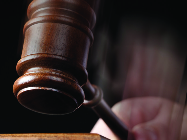 gavel swinging hard and fast