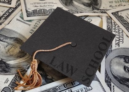 Miniature graduation cap with Law School text, on assorted cash