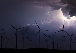 Wind generator array against the background of a lightening storm.