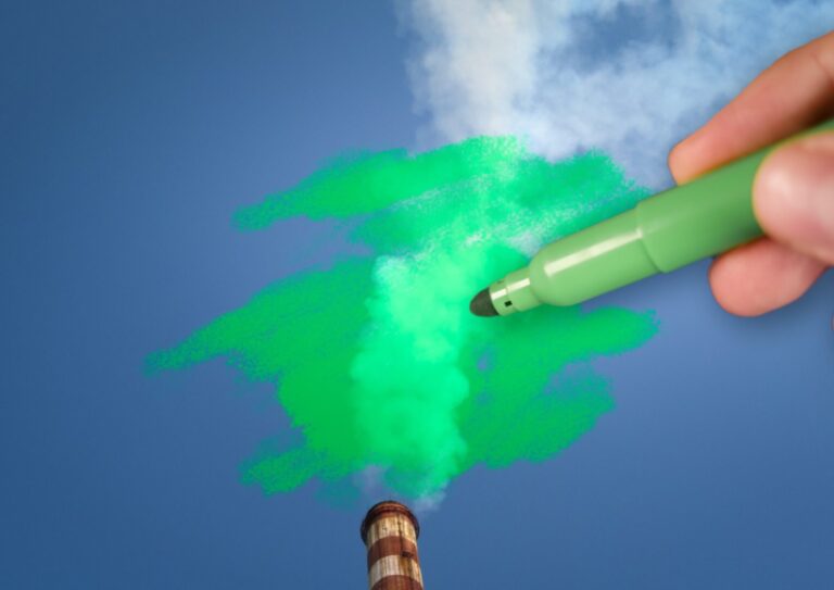 man-painting-green-pollution-from-a-chimney-picture-id1323190392