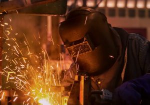 Welder at work, sparks flying.