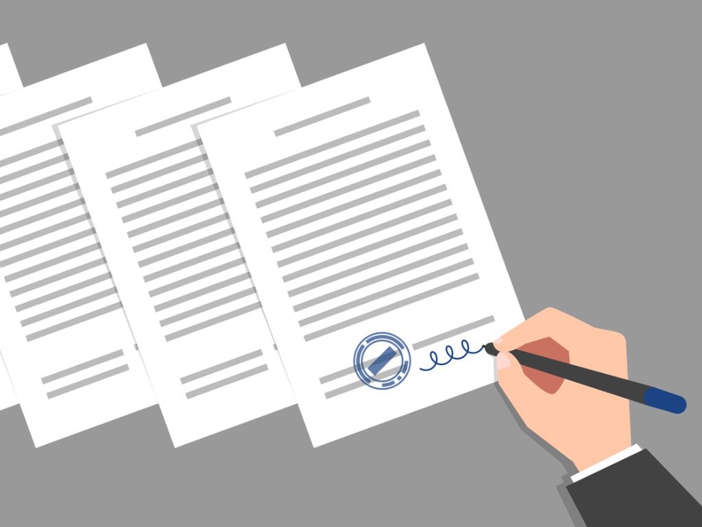 Forecasting The Regulatory Landscape Top Challenges And Opportunities   Stack Of Documents And Hand Of Person Signing Them 