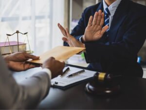 businessman trying to bribe a lawyer