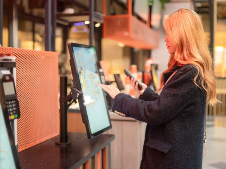 woman at self service kiosk