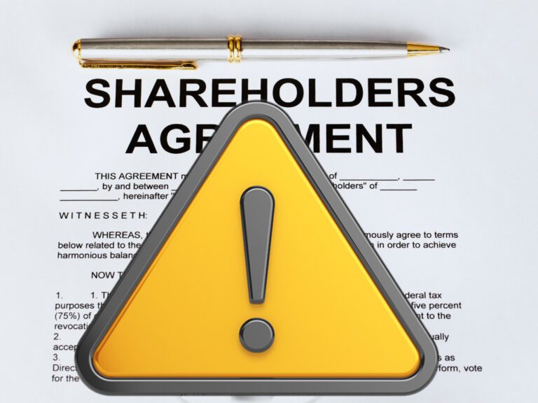 shareholders agreement form with a yellow caution sign over it