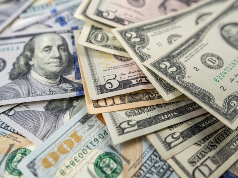 1-2-5-10-100-different-dollar-bills-in-a-pile-as-background Federal Circuit Clarifies Limits on Convoyed Sales, Vacates Damages