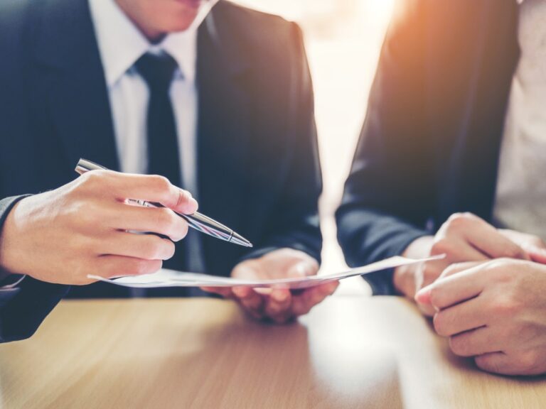 business-people-meeting-negotiating-a-contract-between-two-colleagues Reduce Risk With a Structured Vendor Onboarding Process