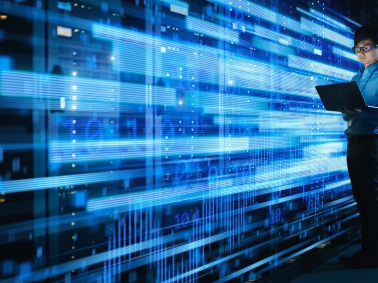 shot-of-asian-it-specialist-using-laptop-in-data-center-full-of-rack-servers-concept-of-high Implications for Digital Advertising and Risk Management with the DOJ Bulk Data Access Rule