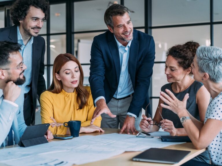 how-GCs-leverage-legal-expertise-to-create-strategic-value-for-c-suite legal team in a meeting