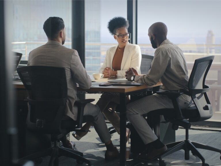 boardroom-conversation-negotiation-proposal-and-business-people-discussion-for-investment Legal Department Models: Centralized, Embedded, or Hybrid?