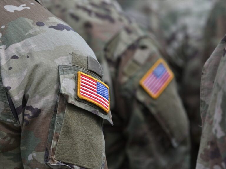 American troops with American flag on uniform