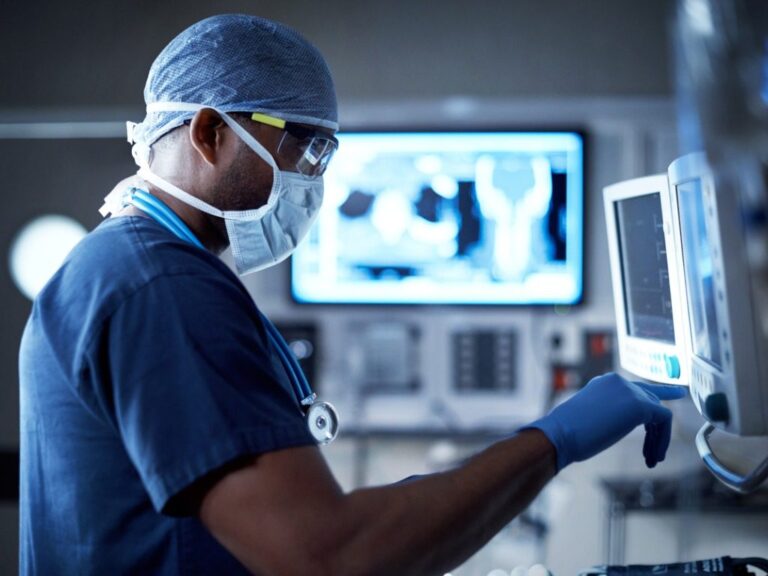 doctor looking at medical equipment