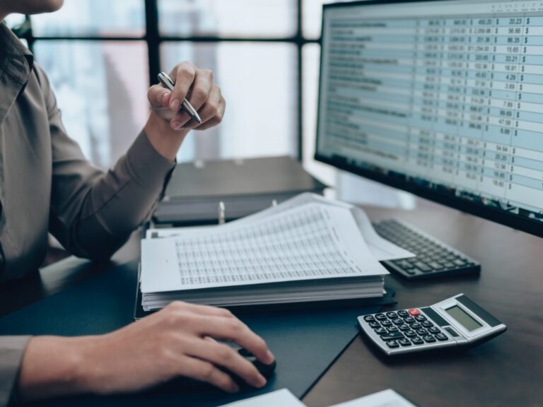 business person working on computer reviewing data